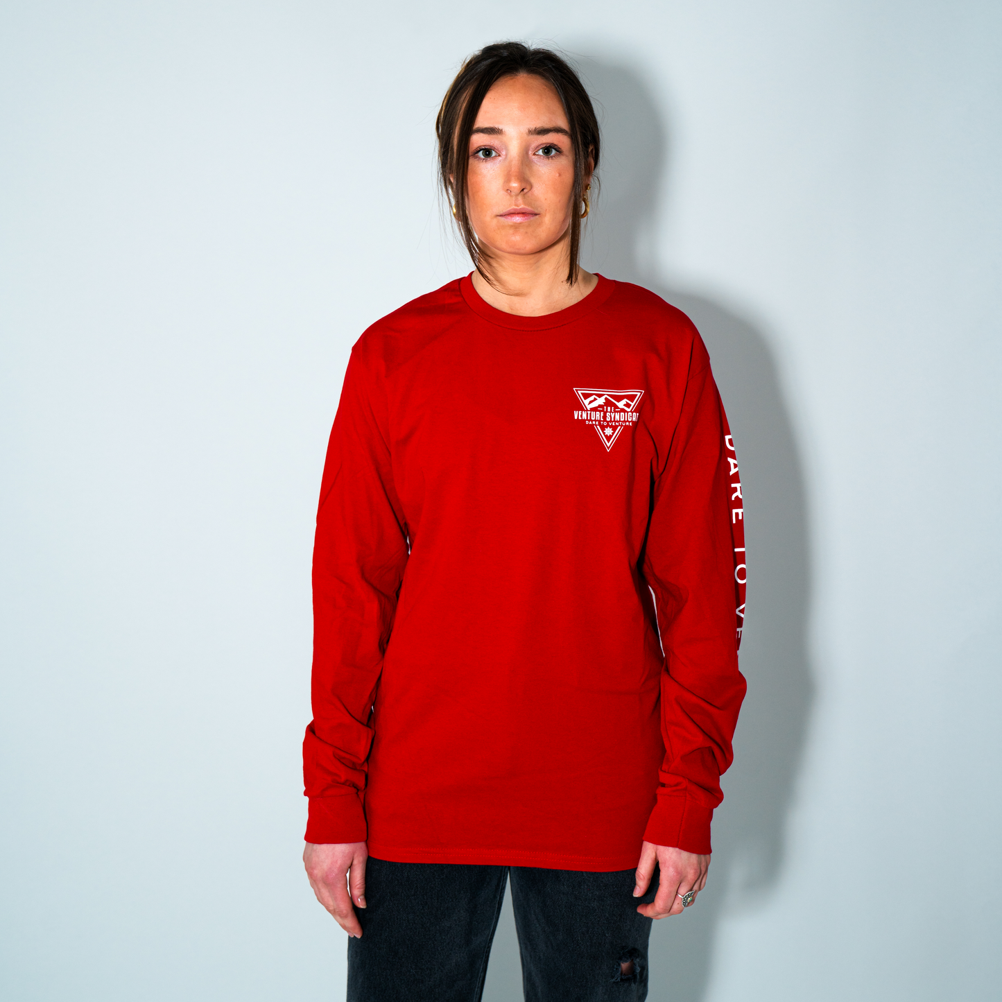 model wearing long sleeve graphic tee red