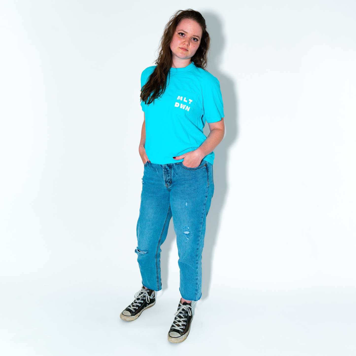 model in blue pocket tee meltdown collection